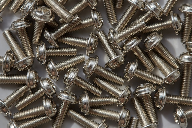 Closeup of metal bolts on gray surface