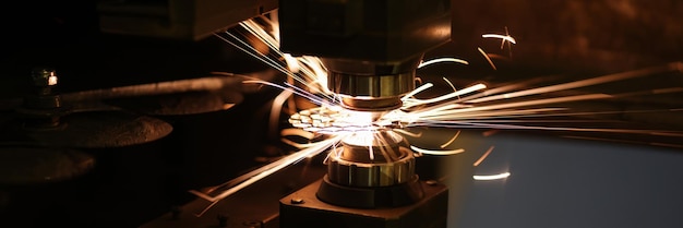 Closeup of metal cutting process and neon sparks flying out laser cutting machine and metal