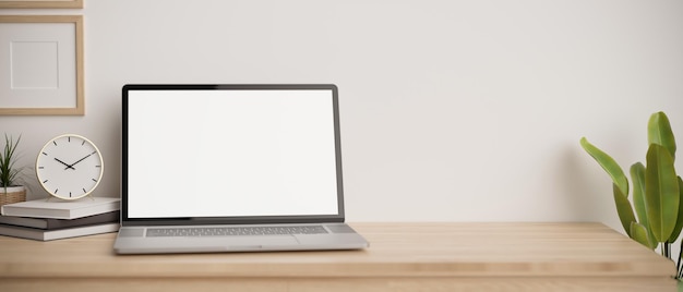 Closeup Minimal workspace tabletop with notebook laptop mockup and accessories on wood table