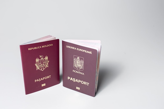 Closeup of Moldavian and Romanian passports isolated on white background