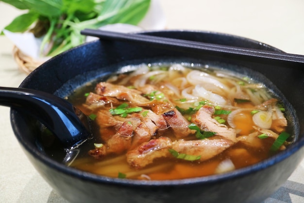 Closeup of Mouthwatering Vietnamese Pho Topped with Grilled Pork