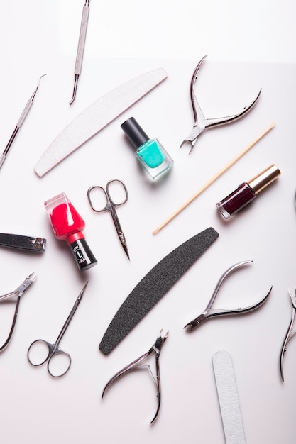 Closeup of nail care products on a gray surface