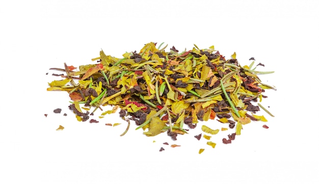 closeup of natural herbal tea made of various loose dried herbs isolated on white