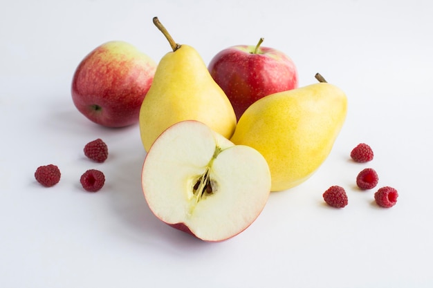 Closeup on pear apple and raspberry on the white background