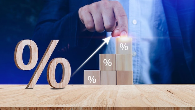 Closeup of percent sign leaning on wooden table Percentage Sign And Discount Rate Accountant VAT Tax Concept