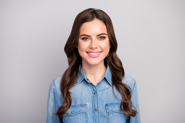 Closeup photo of beautiful pretty lady positive good mood easy-going person beaming smile long brunette hairdo wear casual jeans outfit isolated grey color