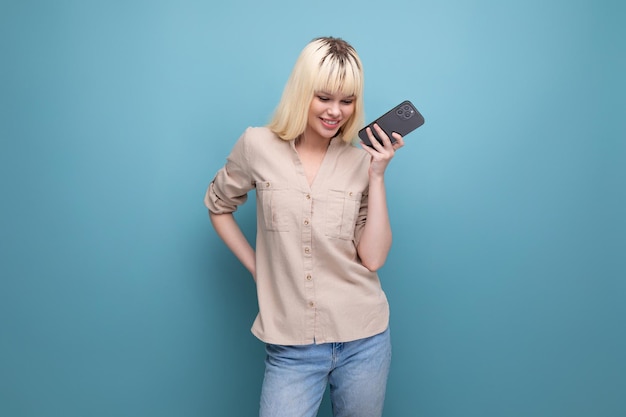 Closeup photo of a charming european blonde woman chatting on the phone