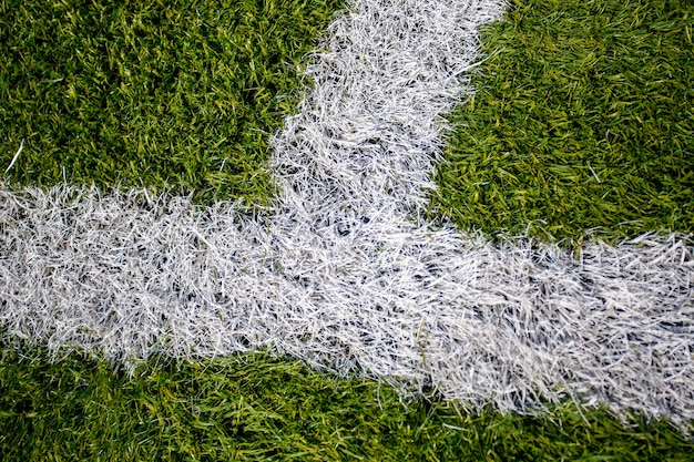 Closeup photo of corner marking on artificial soccer field