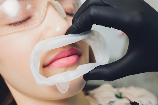 Closeup photo of a disposable dental rubber dam used for keeping soft tissues of mouth safe from den