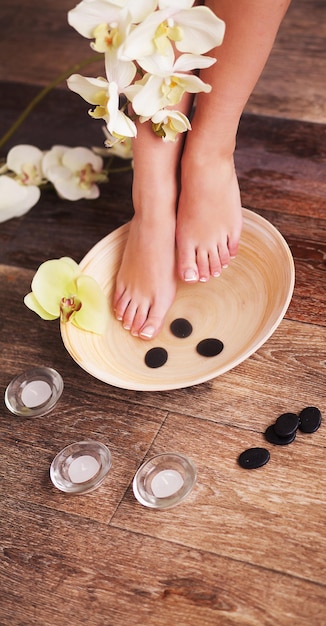 Closeup photo of a female feet at spa salon.