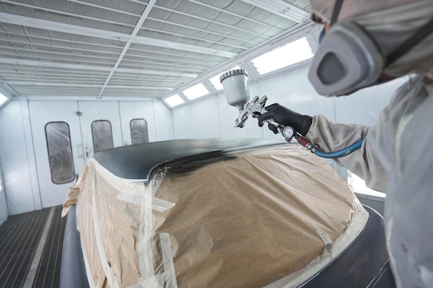 Closeup photo of man working with air gun