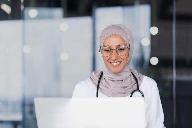 Closeup photo portrait of a female doctor in a hijab a muslim woman works in the office of a modern