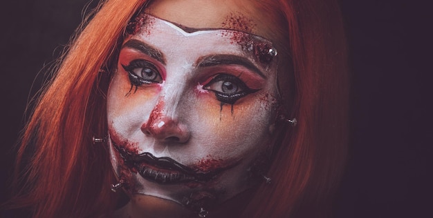 Closeup photo shoot of woman's face with creative scary makeup for Halloween.