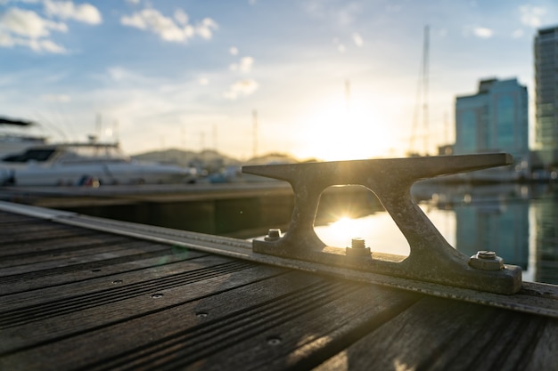 Closeup picture a rope tied to a metal cleat on a yacht deck. High quality FullHD footage