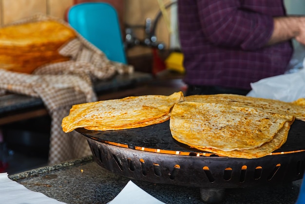 Closeup pita bread is heated for turkish shawarma