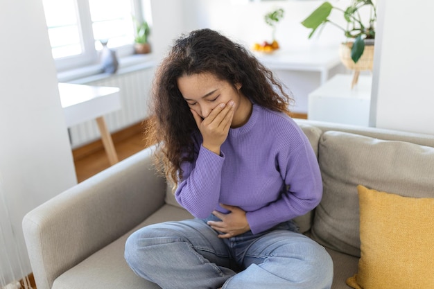 Closeup portrait of Asian unhappy annoyed sick woman about to chuck throw up puke retch barf Negative emotions feelings facial expressions Asian woman with morning sickness