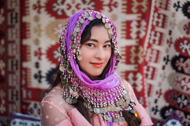 Closeup portrait of Asian woman with ethnic Turkish headscarf. happy woman tourist wear traditional accessories