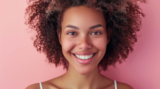 Closeup portrait of a beautiful black woman with curly hair smiling at the camera