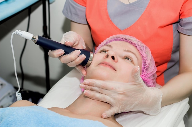 Closeup portrait of a beautiful woman getting RFlifting