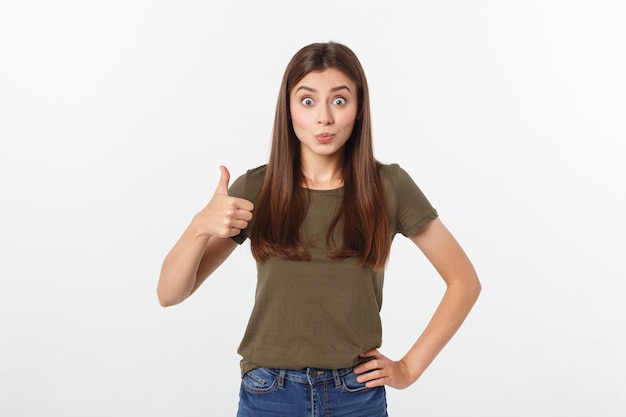 Closeup portrait of a beautiful young woman showing thumbs up sign