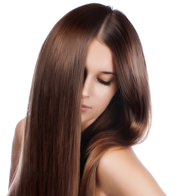 Closeup portrait of a beautiful young woman with elegant long shiny hair