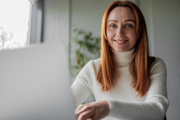 Closeup portrait of a businesswoman working remotely or in the office 30s 40s