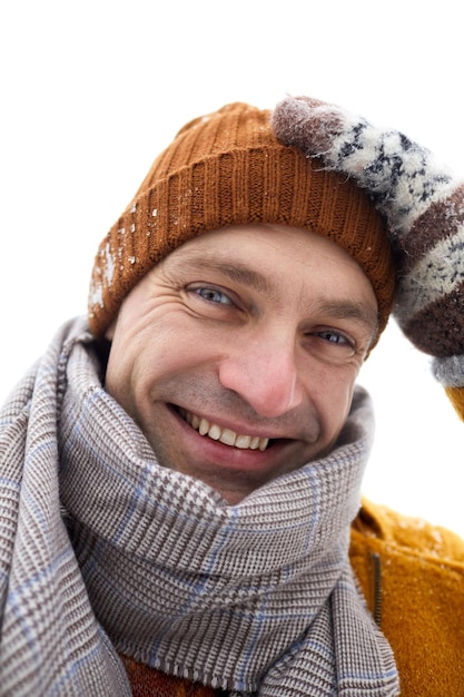 Closeup portrait of carefree young man smiling at camera in winter selfie pov