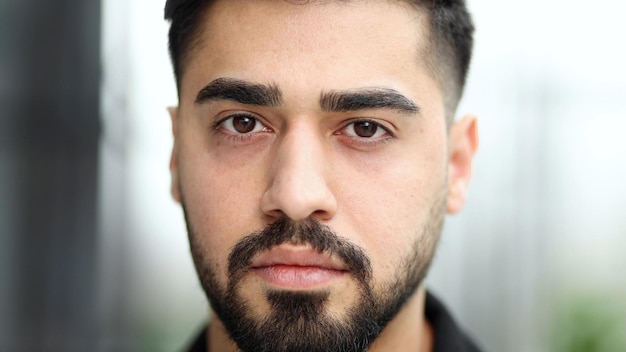 Closeup portrait of a confident businessman against the backdrop of a modern office