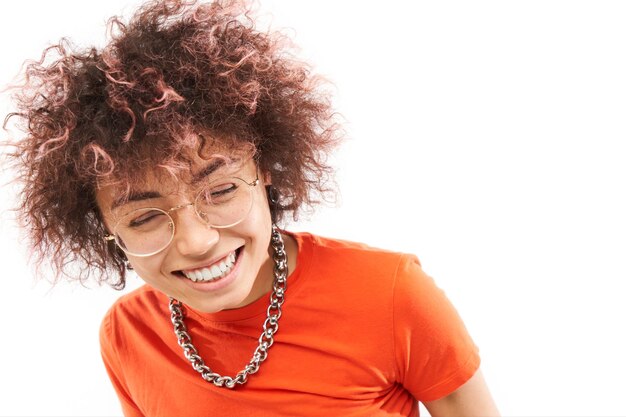 Closeup Portrait of cool happy kazakh model girl with curls tattoo and chain laughing and smiling isolated on white studio background