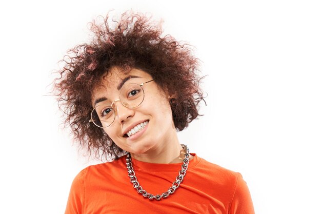 Closeup Portrait of cool happy kazakh model girl with curls tattoo and chain laughing and smiling isolated on white studio background