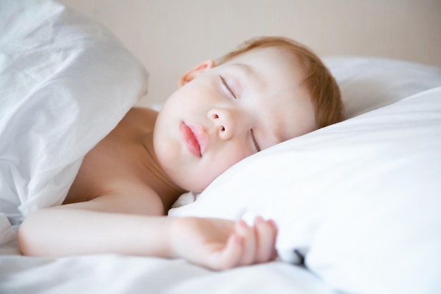 Closeup portrait of a cute little boy Healthy baby sleep concept