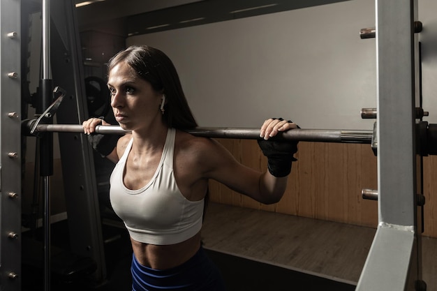 Closeup portrait of empowered female weightlifter