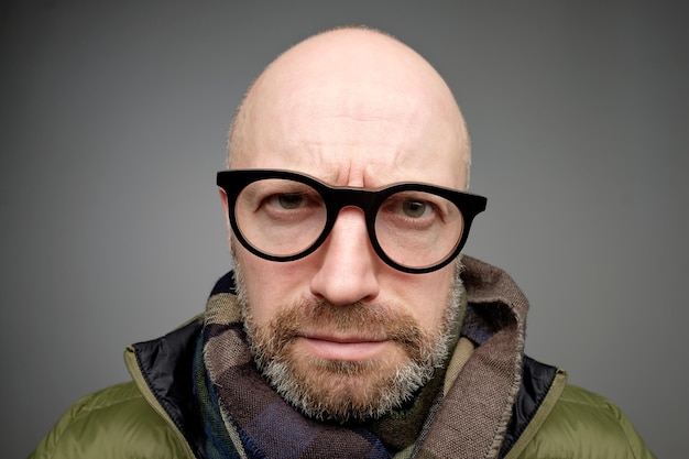 Closeup portrait of european funny mature man thinking trying hard to remember something looking confused