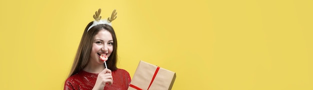 Closeup portrait of a girl with gifts in her hands