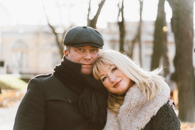 Closeup portrait of happy blonde mature woman and beautiful middle-aged brunette