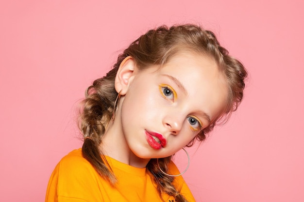 Closeup portrait of her she nicelooking attractive lovely sweet curious cheerful cheery smart clever girl creating new idea solution fantasize copy space isolated pink pastel color background