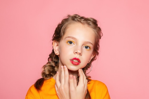 Closeup portrait of her she nicelooking attractive lovely sweet curious cheerful cheery smart clever girl creating new idea solution fantasize copy space isolated pink pastel color background