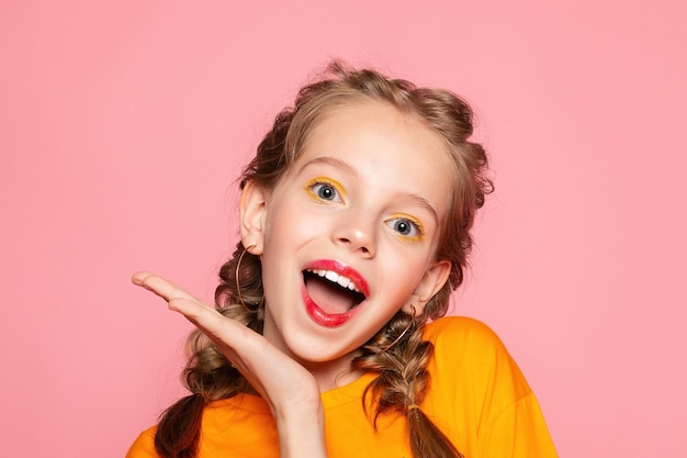 Closeup portrait of her she nicelooking attractive lovely sweet curious cheerful cheery smart clever girl creating new idea solution fantasize copy space isolated pink pastel color background