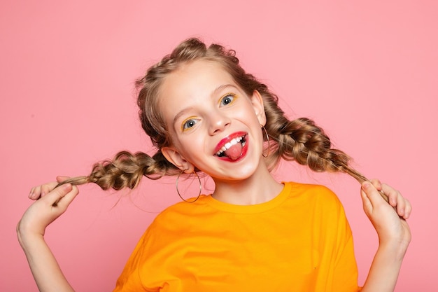 Closeup portrait of her she nicelooking attractive lovely sweet curious cheerful cheery smart clever girl creating new idea solution fantasize copy space isolated pink pastel color background