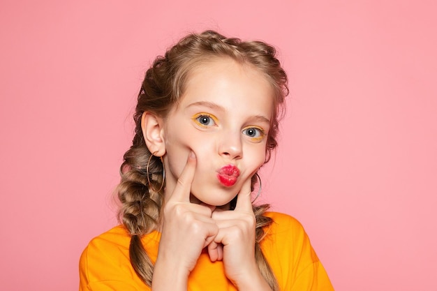 Closeup portrait of her she nicelooking attractive lovely sweet curious cheerful cheery smart clever girl creating new idea solution fantasize copy space isolated pink pastel color background