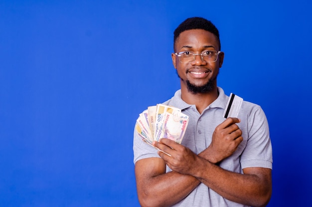 Closeup portrait of his he nice attractive handsome glad successful cheerful guy holding in hands fan cash new bank card