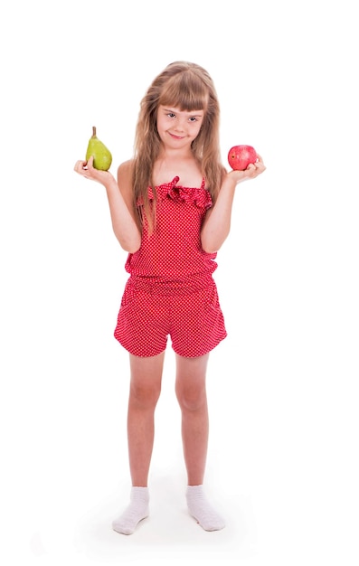 Closeup portrait of a little girl holding fruits apples and pear Isolated on a light background