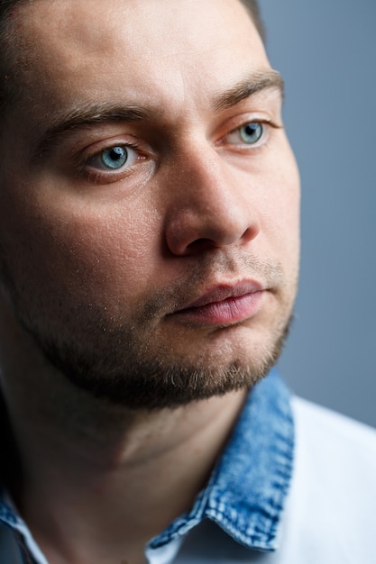 Closeup portrait of a man in a white polo