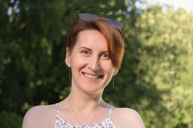 Closeup portrait of a redhaired woman with a short haircut