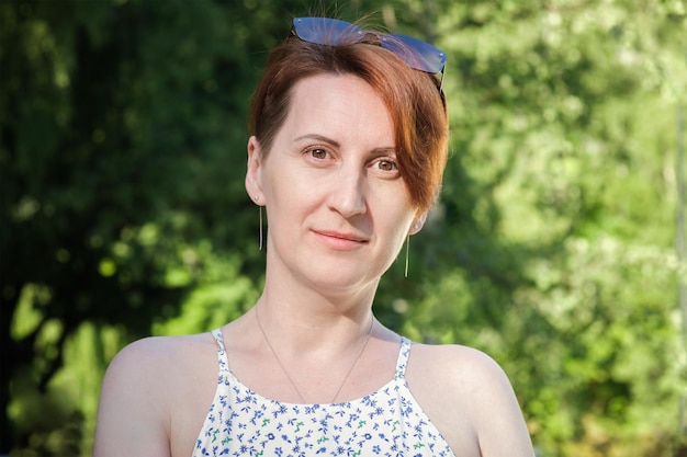 Closeup portrait of a redhaired woman with a short haircut