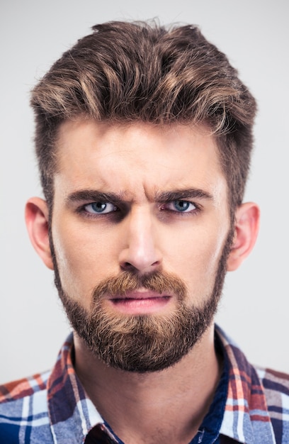 Closeup portrait of a serious man looking at camera