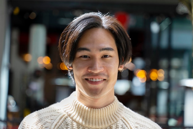 Closeup portrait of smiling asian man looking at camera