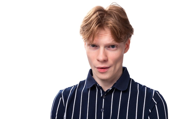 Closeup portrait of a stylish handsome young blond man on a white background