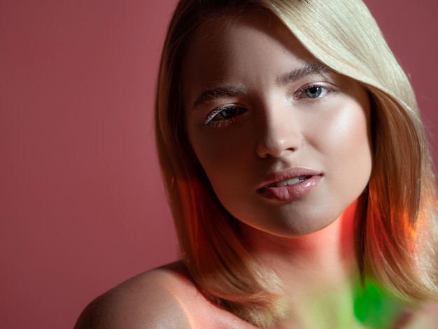 Closeup portrait of a young beautiful woman with blonde hair