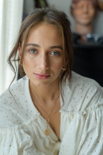 Closeup portrait of a young beautiful woman The women looks into the frame